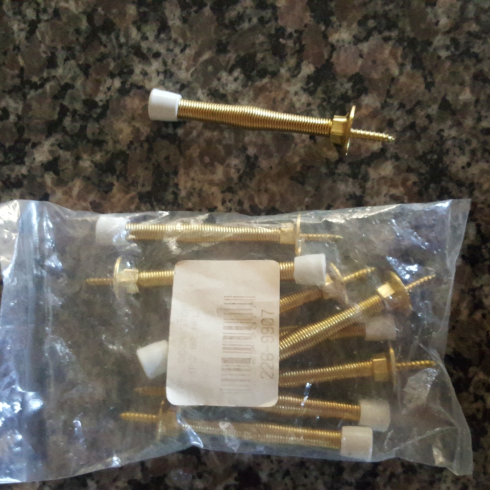 9 pack door stop polished brass new in package with plastic protective end